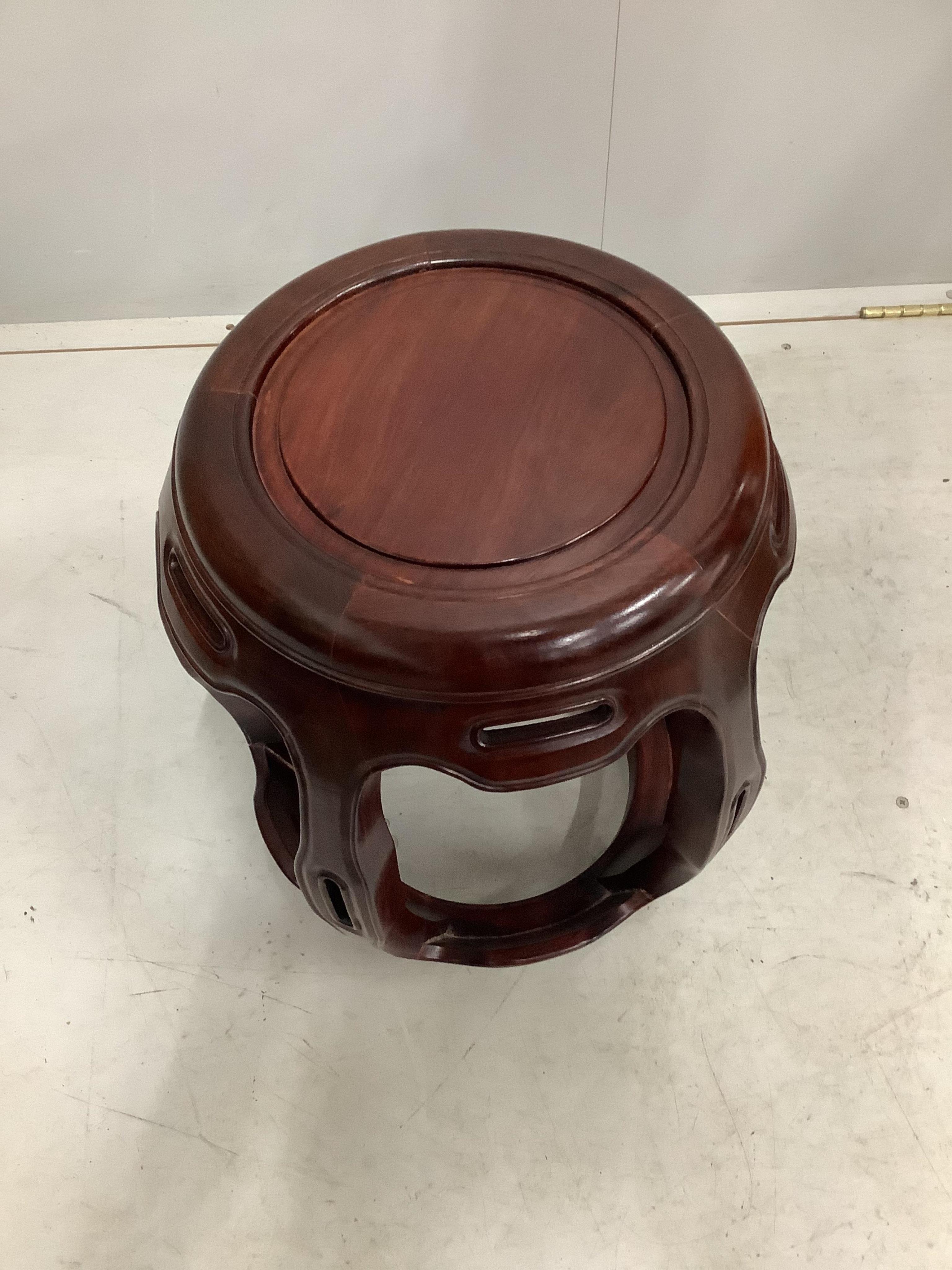 A Chinese hardwood garden seat, height 45cm. Condition - good